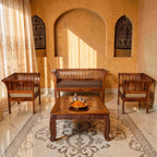 Homecrest Fairlight sheesham wood sofa set with slatted backrests and upholstered cushions in a warm living room setting