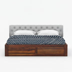Homecrest Farleigh solid Sheesham wood platform bed with a grey tufted upholstered headboard and box storage.