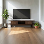 Homecrest Fallow media cabinet in walnut mango wood with a fluted sliding door, positioned under a wall-mounted TV.