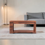 Homecrest Fenwick two-tier rectangular coffee table made of solid walnut-finished sheesham wood with slatted sides.