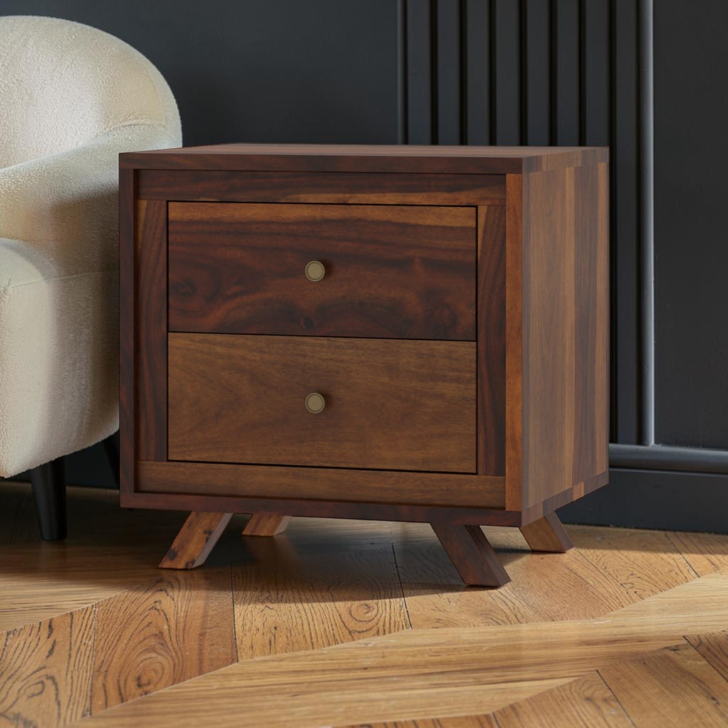 Homecrest Piera mid-century bedside table in dark sheesham wood with two drawers and brass-finish knobs.