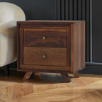 Homecrest Piera mid-century bedside table in dark sheesham wood with two drawers and brass-finish knobs.