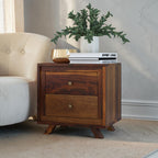 Homecrest Piera mid-century bedside table in sheesham wood with two drawers, brass knobs, and tapered block legs.