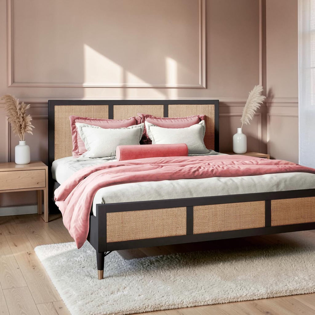 Homecrest Keston black solid mango wood bed frame with natural rattan cane headboard and footboard in a bedroom.