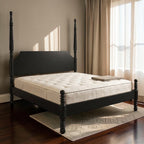 Homecrest Fordham black acacia wood poster bed with carved spiral posts and a statement headboard in a bedroom.