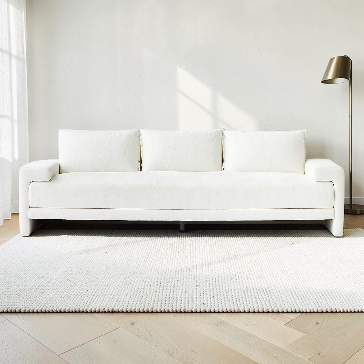 Homecrest Framlingham three-seater sofa in white cotton linen fabric with a minimalist design in a bright living room.