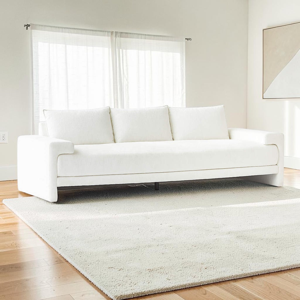 Homecrest Framlingham white three-seater sofa in cotton linen fabric, placed on a rug in a bright living room.