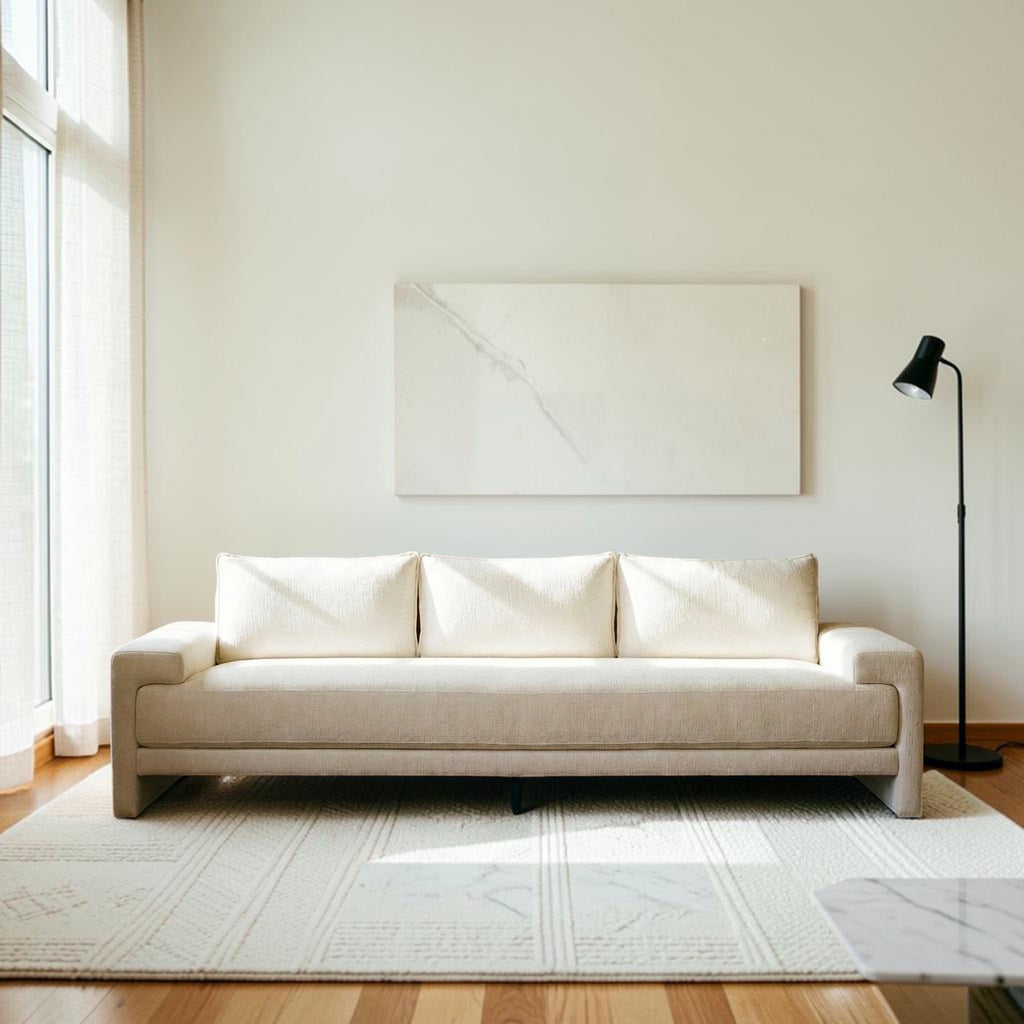 Homecrest Framlingham three-seater sofa in white cotton linen fabric against a rustic wall with a vintage rug