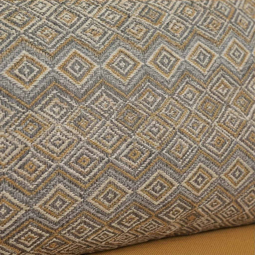 Homecrest sofa cushion featuring a textured grey and mustard yellow geometric diamond pattern fabric