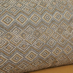 Homecrest sofa cushion featuring a textured grey and mustard yellow geometric diamond pattern fabric