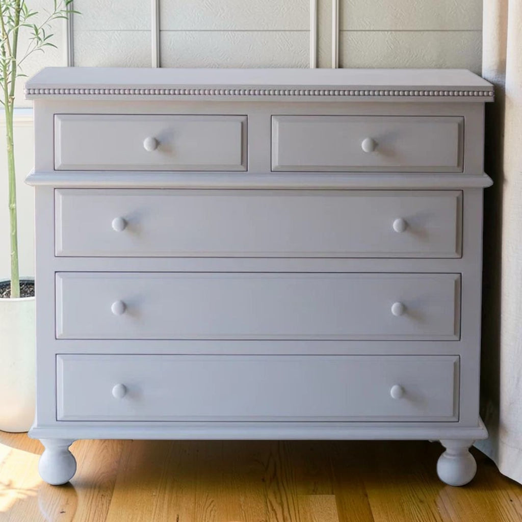 Homecrest grey solid mango wood five-drawer chest with beaded moulding and classic bun-foot legs.