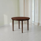 Homecrest Halland round dining table in dark teak finish made from solid sheesham wood with a minimal design