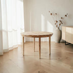 Homecrest Halland round dining table in natural sheesham wood with a minimalist Scandinavian design