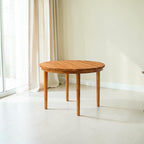 Homecrest Halland round dining table in natural sheesham wood with a minimal Scandinavian design