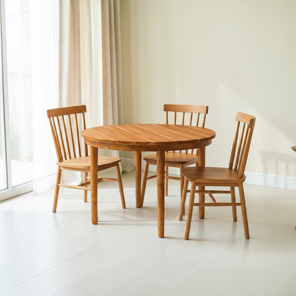 Homecrest Halland round sheesham wood dining table with three matching spindle-back chairs in a bright room
