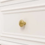 Homecrest Halstead twelve-drawer chest in white sheesham wood featuring a detailed brass knob on a drawer front
