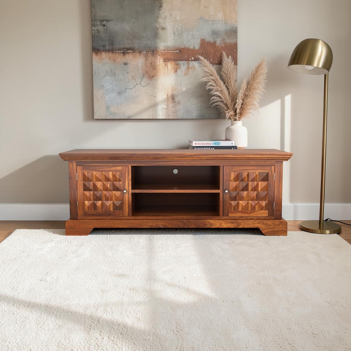 Homecrest Idris low-rise media unit in solid sheesham wood with geometric cabinet doors and a natural matte finish.