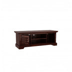 Homecrest Idris low-rise media unit in solid walnut-toned sheesham wood with a textured geometric cabinet door