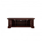 Homecrest Idris low-rise media unit in solid walnut-toned sheesham wood with carved cabinet doors and open shelving.