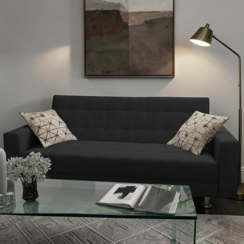 Homecrest Kesler dark grey polyester three-seater sofa cum bed with decorative patterned cushions in a living room.