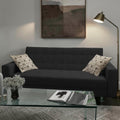 Homecrest Kesler dark grey polyester three-seater sofa cum bed with decorative patterned cushions in a living room.