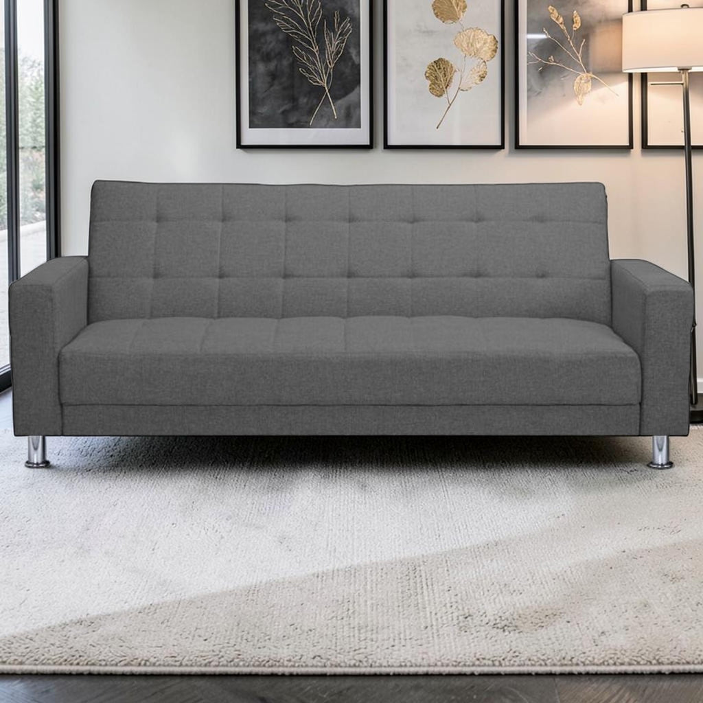 Homecrest Kesler compact grey polyester sofa cum bed with tufted backrest and chrome legs in a modern living room