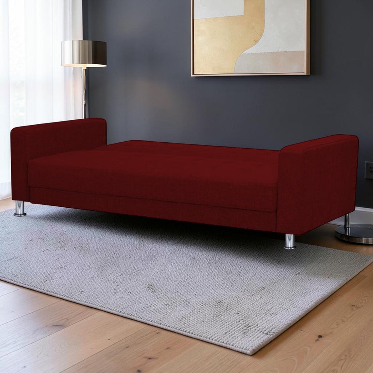 Homecrest Kesler maroon polyester sofa cum bed with a solid wood frame and modern chrome legs in a living room setting.