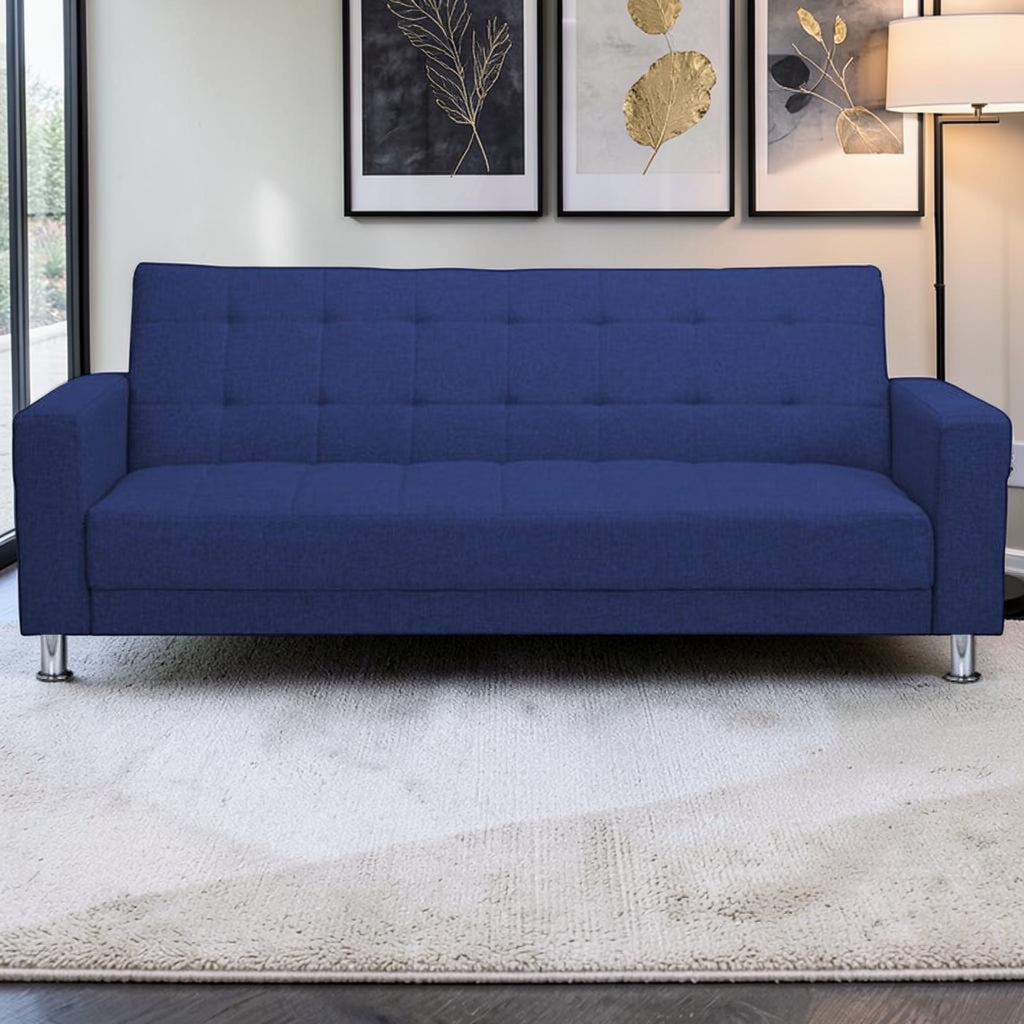 Homecrest Kesler navy blue polyester three-seater sofa bed with tufted backrest and chrome legs in a modern living room