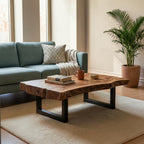 Homecrest Kestrel live edge solid wood coffee table with a black metal frame in a modern living room setting.