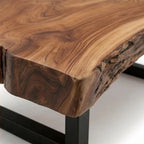 Homecrest Kestrel coffee table featuring a natural solid wood slab with a live edge on a black metal frame