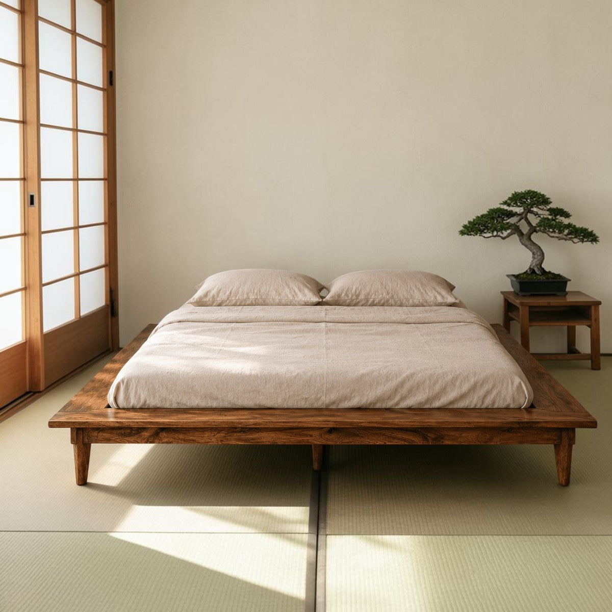 Homecrest Lyra low floor platform bed made of solid Sheesham wood with tapered legs in a minimalist bedroom setting