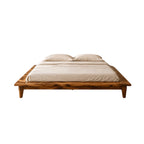 Homecrest Lyra low floor platform bed made of solid Sheesham wood with a natural grain and tapered legs.