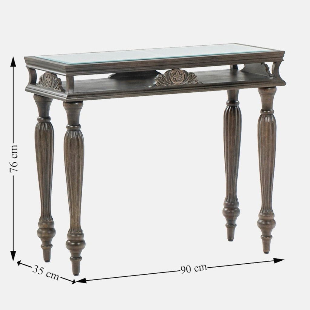 Homecrest Larkin console table in brown sheesham wood with a glass top and ornate carved legs