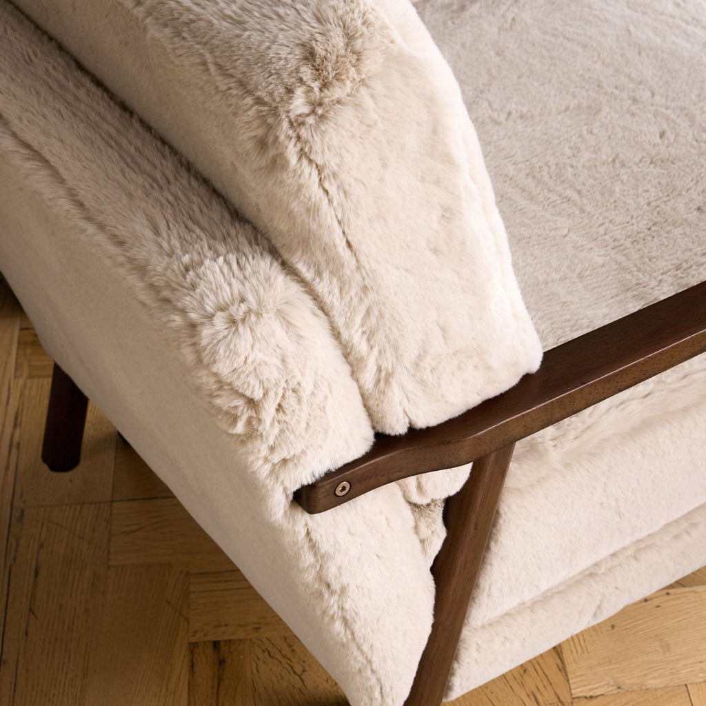 Homecrest Lars Scandi accent chair with cream faux fur upholstery and a dark solid wood frame