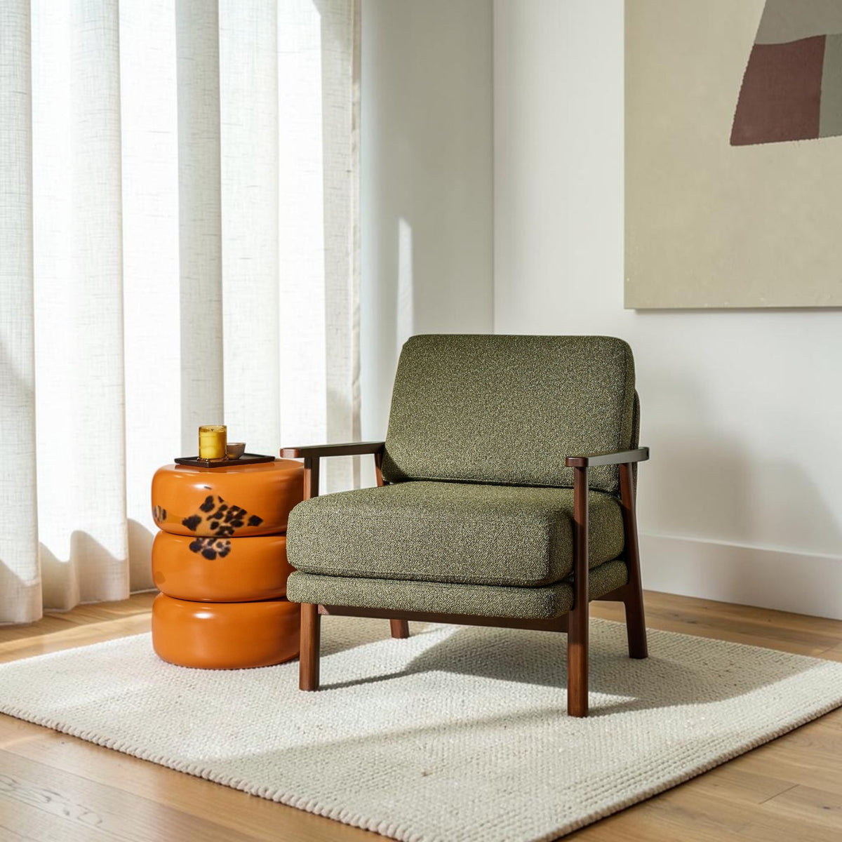 Homecrest Lars Scandi accent chair in green bouclé fabric with a dark solid wood frame in a bright living room.