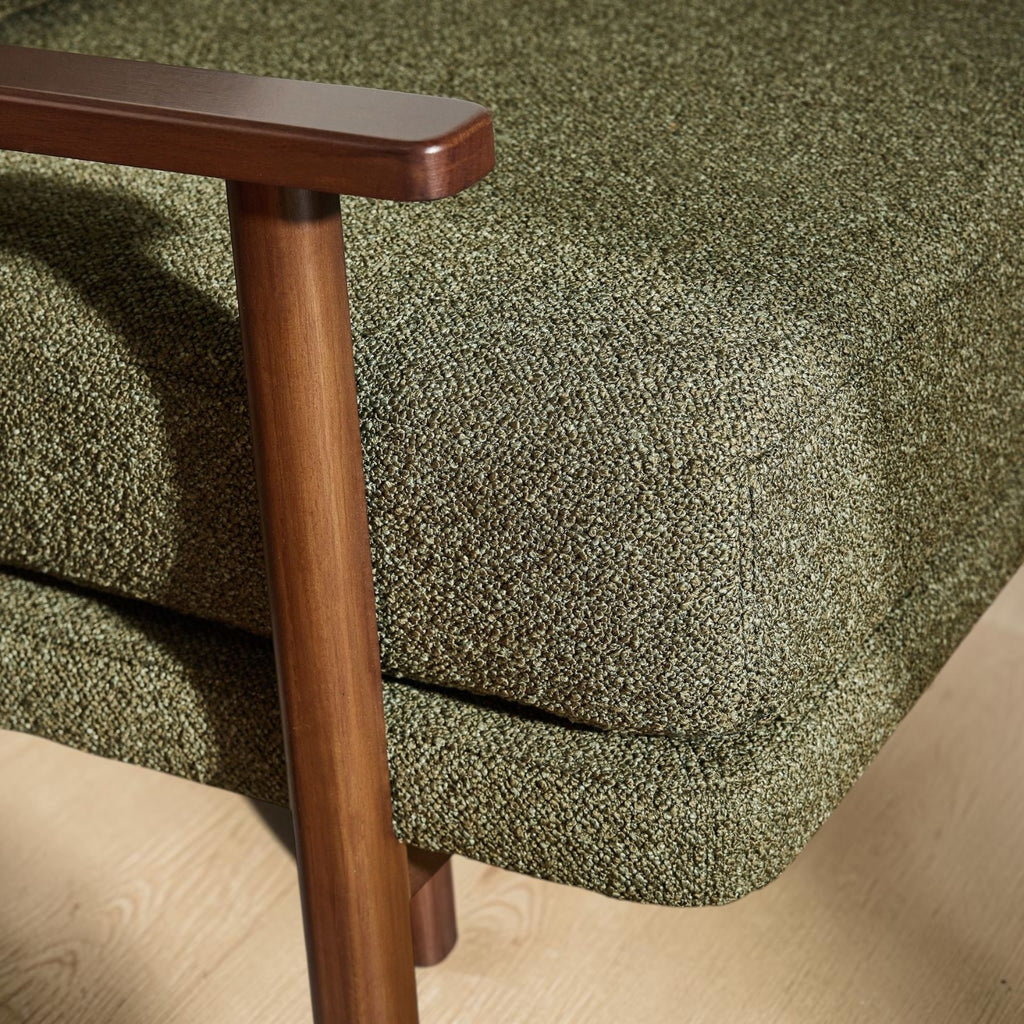 Homecrest Lars Scandi accent chair featuring a dark wood frame and textured olive green bouclé cushioned seat