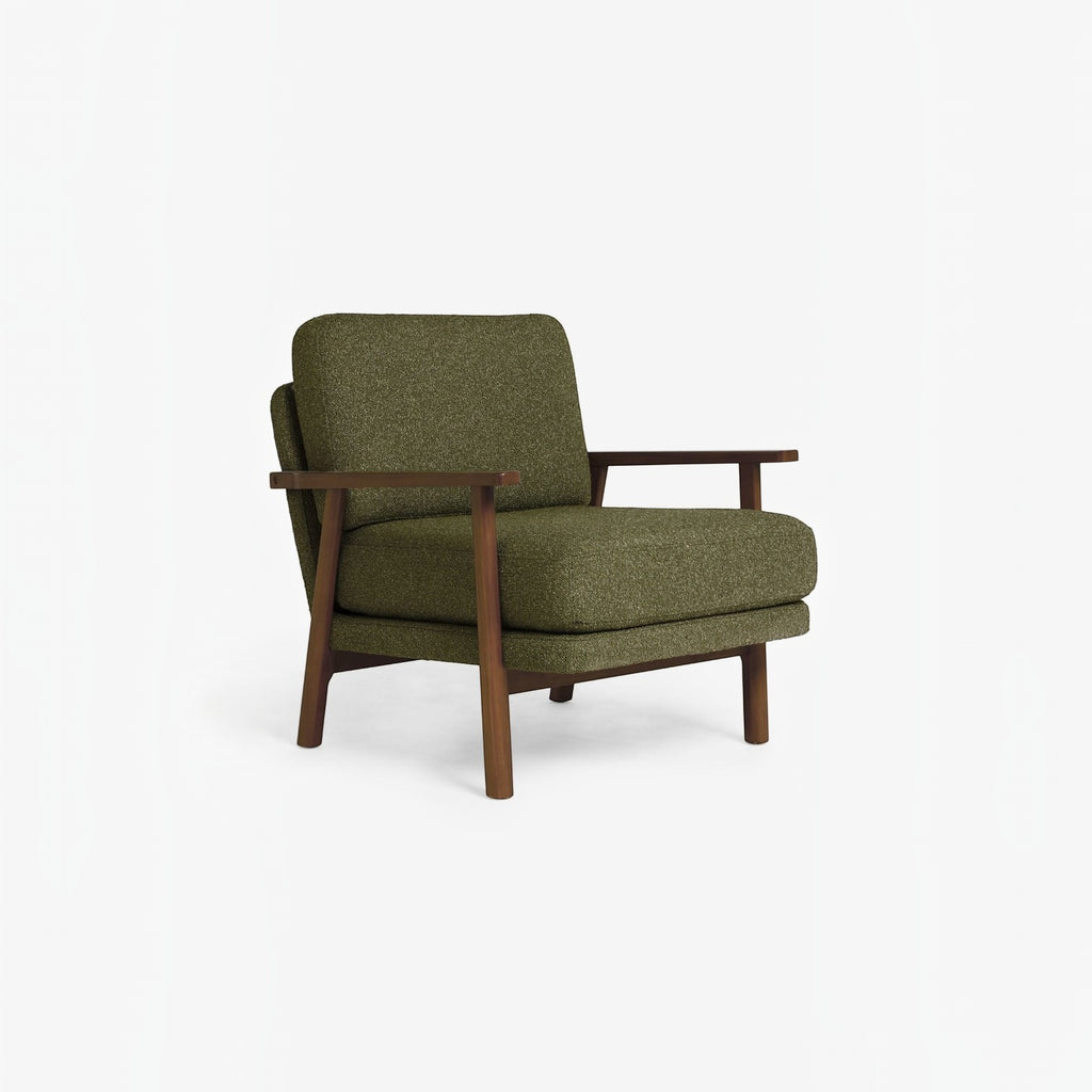 Homecrest Lars Scandi accent chair with a dark solid wood frame and deep olive green bouclé cushioned seat
