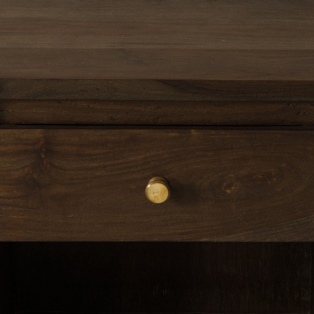 Homecrest Latimer bedside table featuring a dark brown hand-carved solid wood drawer with a round brass knob.