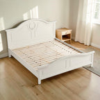 Homecrest light beige Sheesham wood standard bed with a decorative carved headboard and wooden slat base