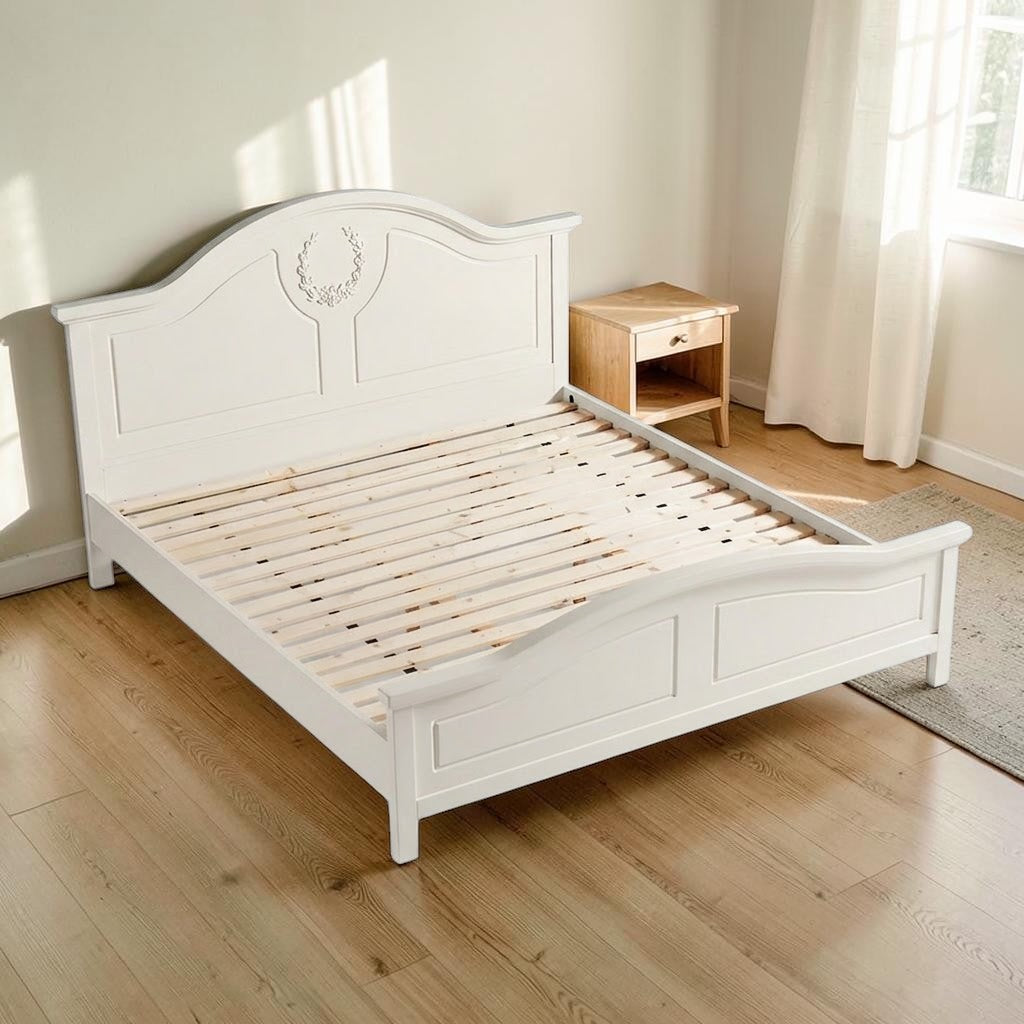 Homecrest light beige Sheesham wood standard bed with a decorative carved headboard and wooden slat base