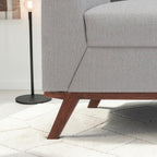 Homecrest Lindholm Scandinavian sofa featuring light grey textured upholstery and a dark teak wood base frame