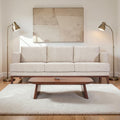 Homecrest Linnea contemporary sofa in parchment fabric with a slim profile, teak wood base, and recessed arms.
