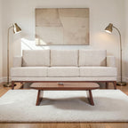 Homecrest Linnea contemporary sofa in parchment fabric with a slim profile, teak wood base, and recessed arms.
