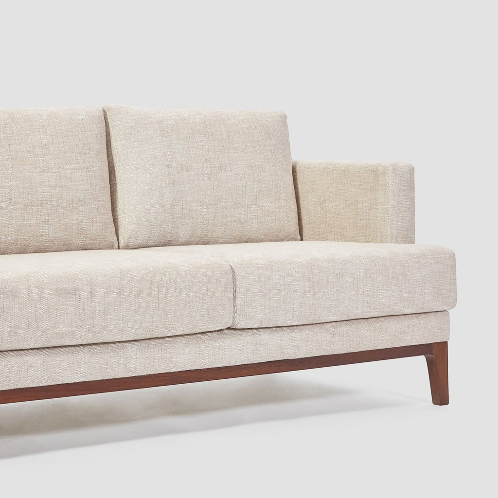 Homecrest Linnea contemporary sofa in parchment fabric with a slim profile, recessed arms, and a solid teakwood base.
