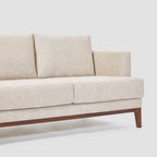 Homecrest Linnea contemporary sofa in parchment fabric with a slim profile, recessed arms, and a solid teakwood base.