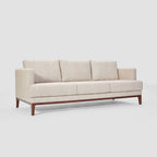 Homecrest Linnea contemporary sofa in parchment fabric with a slim profile, recessed arms, and teak wood base frame.