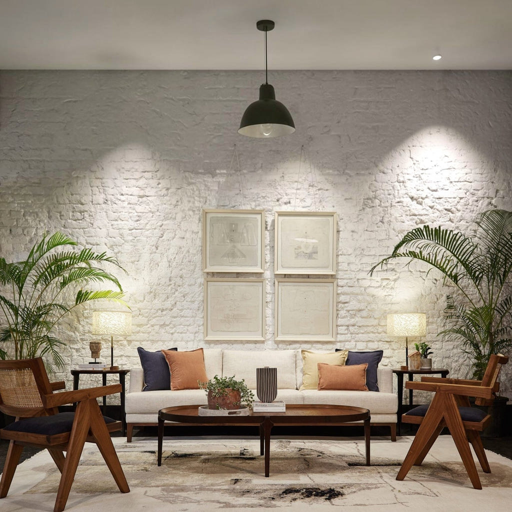 Homecrest Linnea slim-profile contemporary sofa in parchment upholstery with teak wood frame in a modern living room.