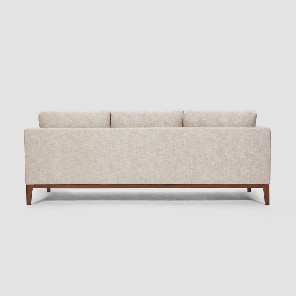 Homecrest Linnea contemporary sofa in parchment fabric with a slim profile, recessed arms, and teak wood base.