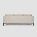 Homecrest Linnea contemporary sofa in parchment fabric with a slim profile, recessed arms, and teak wood base.