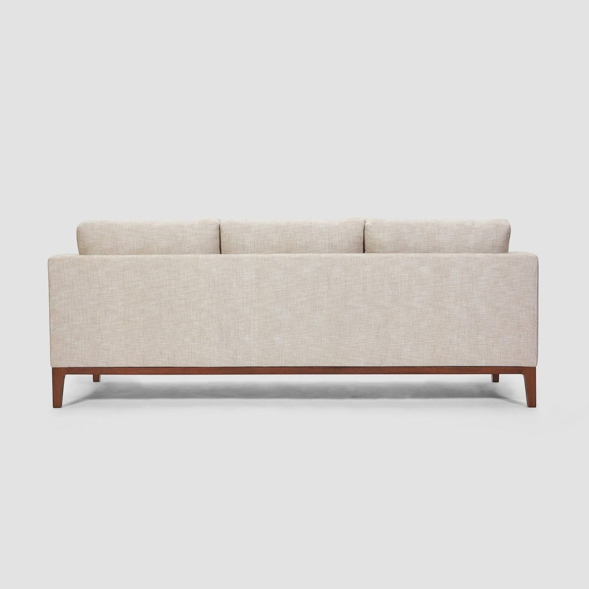 Homecrest Linnea contemporary sofa in parchment fabric with a slim profile, recessed arms, and teak wood base.